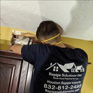Repipe Solutions Inc technician performing whole home repiping service in Pasadena TX residential property
