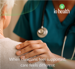A clinician helping a patient and using io Health