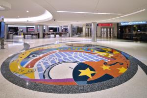 Medallion in terrazzo with colorful images evoking Nashville's musical heritage