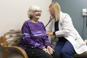 Woman and her doctor at PACE center