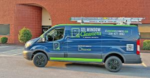 STL Window Cleaners service van parked outside a commercial building in the Greater St. Louis area.