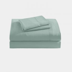 Folded sage green bed sheet set with matching pillowcases, displayed against a plain background to highlight the fabric texture and color.