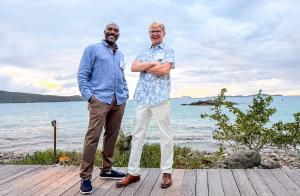 Brandon Smith and Brandon Gresham, co-owners of BookVI luxury villa rentals and Love City Management, standing along the waterfront in St. John, USVI.