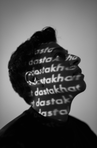 Black and white Anuv Jain portrait with Dastakhat text projection promoting Dastakhat World Tour 2026 and Anuv Jain North American Tour 2026.