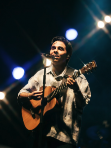 Anuv Jain Live Concert performance singing and playing acoustic guitar during Dastakhat World Tour 2026 North America US Tour.