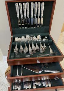 Tiffany & Co. 103-piece dinner and luncheon set in the Audubon pattern, without a single piece missing, housed in a three-tier Reed and Barton silverware chest. Estimate: $22,000-$24,000.
