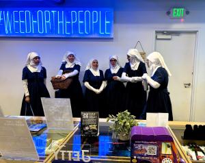 the sisters posing for a photo as a group inside a catalyst dispensary