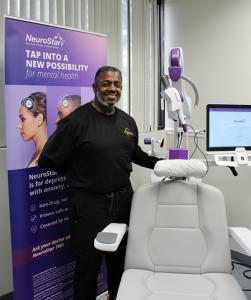 DreamWork CEO Marcus Logan with TMS Therapy Machine in Sherman Texas