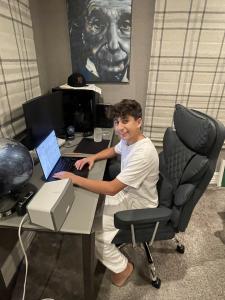 Evan Yadegari, coding at his laptop