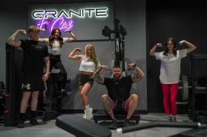 Granite Fit Club members and staff posing inside the gym in Prescott Valley, AZ.