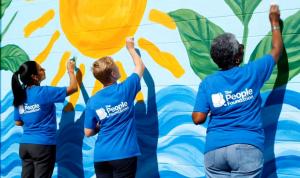 Community volunteers participate in a collaborative service project supported by The People Foundation.