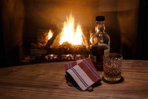handkerchief and whisky in front of a fire