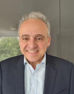 Professional headshot of Jonathan Shaul, CFO at Image Analysis Group, wearing business attire and looking at the camera against a neutral background.