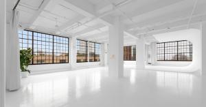 Interior of Daylight Studio in Hudson Yards, New York City, featuring a bright white open loft space with large industrial windows at 450 West 31st Street, 10th Floor.