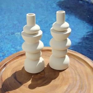 White Sculptural Ceramic Vases on Wooden Tray by Pool