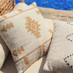Beige Textured Throw Pillow With Tan Geometric Pattern
