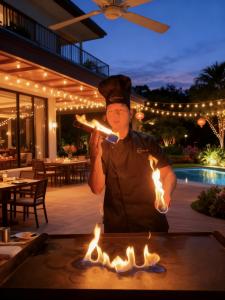 Friendly Hibachi Chef at Home Cooks and Performs