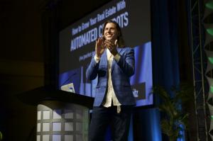 Matt Leitz speaking on stage at an event.