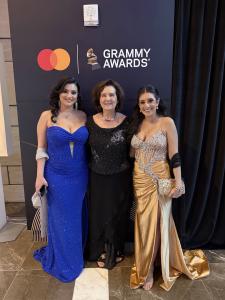 Farrah Mechael, mother, and Tamara Mechael posing at the official Grammy Awards step-and-repeat backdrop.