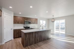 Picture of a beautiful kitchen and kitchen island with designer features.