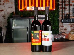 Two bottles of Prova Spirits Bourbon Barrel Fernet with variant labels are displayed