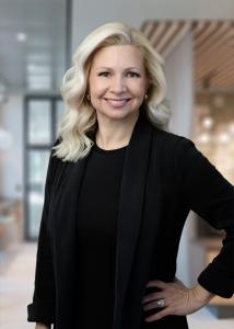 Blonde Caucasian woman dressed in professional attire