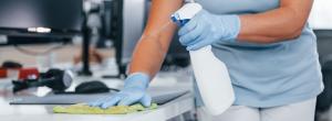 woman cleaning desk