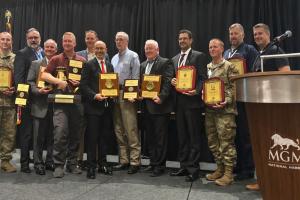Award recipients on stage at the 2025 NPMC PETRO 26 Military & Industry Aviation Fueling Seminar at MGM National Harbor