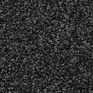 Close-up texture of CARBONOX™ material granules, lightweight and ultra-durable carbon-based composite used in Luminox watch cases.