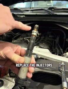 BMW X5 Spark Plugs with Carbon Buildup causing engine misfire codes.