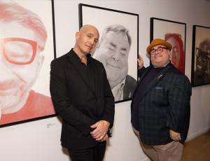 Billy Zane and Joshua Gogarty in front of Billy Zane's exhibit, "A GUY WALKS INTO A BAR..." in front of Joshua's photo. Billy Zane is returning to the Leica Gallery Los Angeles on Saturday, February 28.