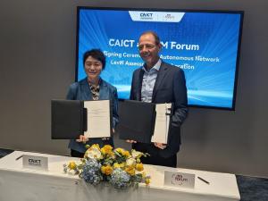 Andy Tiller, TM Forum, and Zhiqin Wang, CAICT, sign landmark partnership agreement at Mobile World Congress 2026.