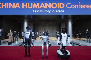 Humanoid robots posing at the entrance of AW 2026 in Coex