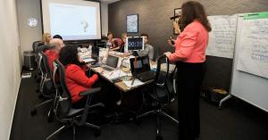 TrainSMART instructor leading a Train-the-Trainer workshop with participants practicing facilitation skills