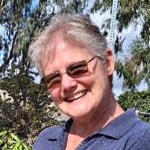 Sharla H Riead Headshot with Leaves in Background