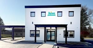 Front exterior of Hive Dispensary in New Paris, Ohio, featuring the storefront entrance and Hive signage.