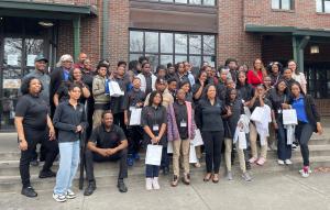 Students and Adults on restaurant steps.