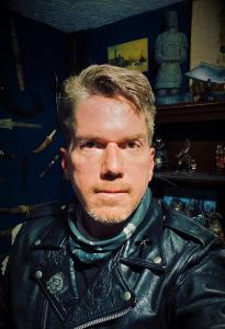 Photo of Internationally Acclaimed Cybersecurity Expert Jayson E. Street wearing a leather jacket