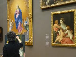 Artist painting in Museum creating museum quality painting for art collection