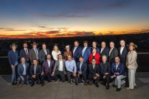 Cornerstone International Alliance partner firm representatives posing as a group at sunset during their 2025 annual meeting.