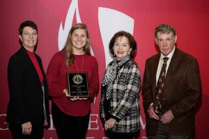 Members of the Tucker family pose with Leah Carpenter, the first recipient of the Tucker Heart, Soul, Mind, and Strength Scholarship. From left, are, Lisa Tucker, Leah, Carolyn Tucker and Robert Tucker.