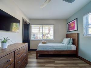 Interior upscale room with a bed and dresser