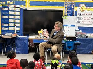 Natchez Mayor Dan M. Gibson reading to a class of schoolchildren at McLaurin Elementary School, part of the Natchez-Adams School District.