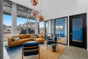 Interior lobby at Atrium Court affordable housing with copper globe pendant lights, Seattle.