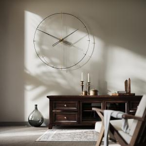 Voglana Estilo modern wall clock in a sunlit living room, where minimalist design meets warm natural interiors