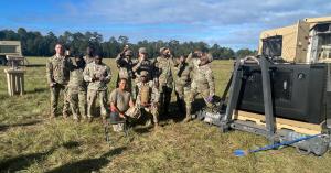 WaterCube at Military Testing, U.S. Army Service Members Pose with WaterCube 100M as They Drink Water From Air