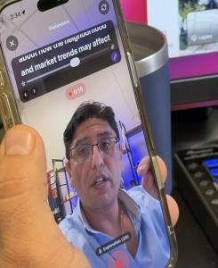 Real estate agent using ReelMap Studio app with guided prompts while recording a video on a smartphone