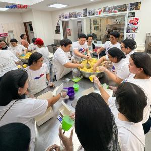 SuperStaff employees packing meals at Kawa Pilipinas headquarters
