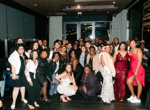 group of people posing for sneaker ball photo