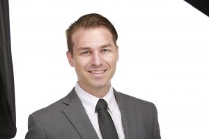 Professional headshot of Brandon Kent, business leader participating in AI and technology discussions at the Cultivating the Future with AI event.